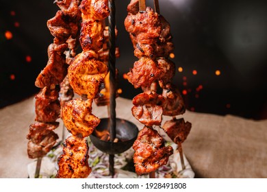 fried pork skewers on the grill