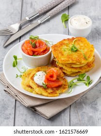 Fried Potato Pancakes With Salmon And Sour Cream, Fritter, Roesti, Golden Crispy Crust. Traditional Delicious Food, Breakfast