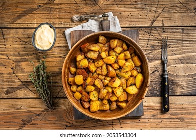 Fried potato - Patatas bravas traditional Spanish potatoes snack tapas. wooden background. Top view