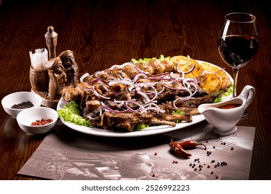 fried ribs, rib kebab, kebab, kebab with vegetables, a glass of wine - Powered by Shutterstock