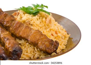 Fried Rice And Honey Soy Chicken Sticks Over White.