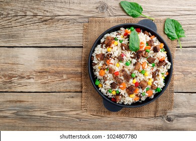 Fried Rice With Meat. Prepared And Served In A Pan.top View