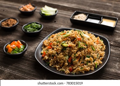 fried rice in plate on table in restaurant