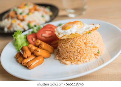 Fried Rice With Sausage And Fried Egg On The Table