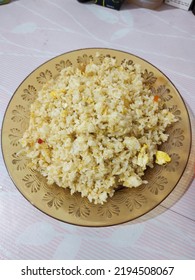 Fried Rice With Scrambled Egg On Baby Pink Background