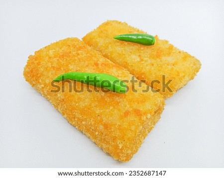 Fried Risoles or Risol Mayo (Traditional food) with a chili isolated on the white background
