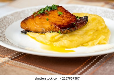 Fried Salmon On Mashed Potato On White Plate, Serving Size, Closeup.