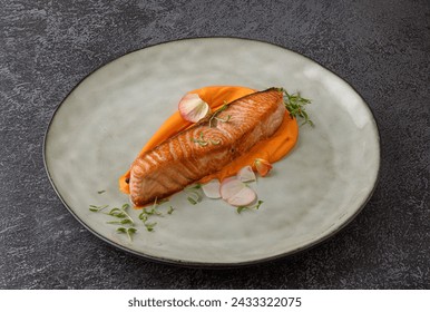 Fried salmon steak with vegetable puree. Grilled red fish fillets. Trout steak with carrot and potato puree. - Powered by Shutterstock