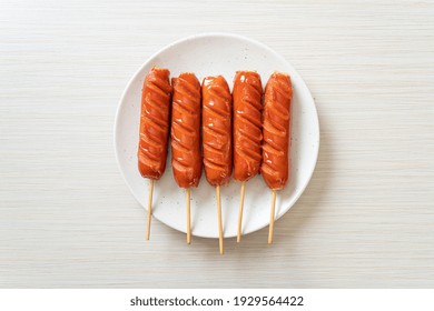 Fried Sausage Skewer On White Plate