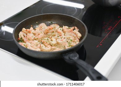 Fried Shrimp In A Pan. Cook On Electric Stove