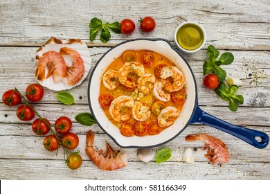 Fried shrimp with tomatoes and garlic. Mediterranean and Italian food. 