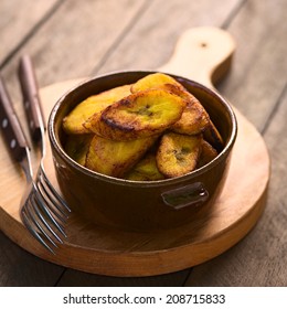 Fried Slices Of The Ripe Plantain In Bowl, Which Can Be Eaten As Snack Or Is Used To Accompany Dishes In Some South American Countries (Selective Focus, Focus On The Front Of The Upper Plantain Slice)