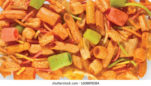 Fried and Spicy mix frymus, cocktail (Khichadi) Colourful, Square, cup, ABCD, pasta, Noodles, triangle, wheel and pipe shape Fryums Papad or fingers is a crunchy Snack Pellets - Image