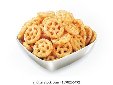 Fried and Spicy wheel Snacks or Fryums (Snacks Pellets) served in a bowl or White background. selective focus - Image