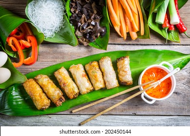 Fried Spring Rolls Surrounded By Ingredients