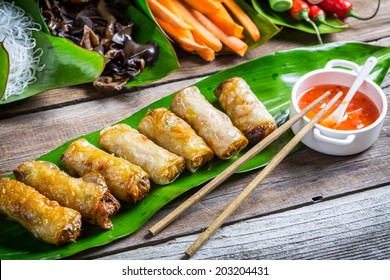 Fried Spring Rolls Surrounded By Ingredients