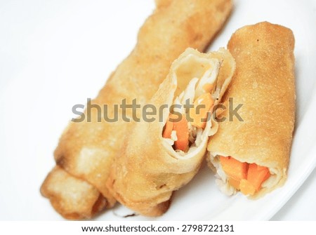 fried springrolls isolated on white plate  background