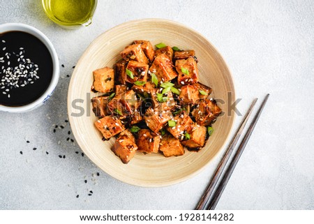 Similar – Image, Stock Photo Vegetarian vegetable and tofu sandwich with yogurt sauce. black background