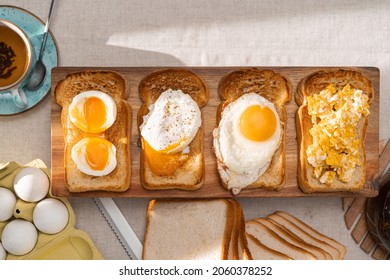 Fried Toast Bread With Four Different Types Of Cooked Chicken Eggs, Scrambled Eggs, Fried Eggs, Poached Egg And Creamed Egg. Breakfast Of Chicken Eggs.