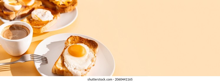 fried Toast bread with four different types of cooked chicken eggs, scrambled eggs, fried eggs, poached egg and creamed egg. 