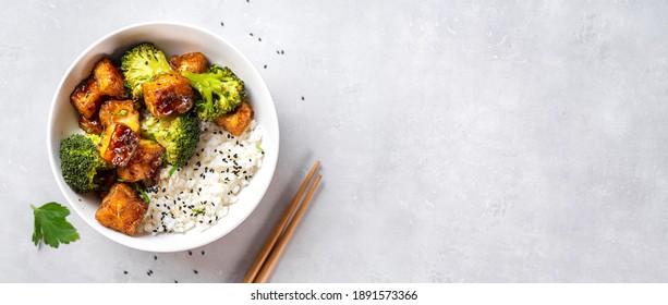 Fried tofu bowl with broccoli and rice. Vegan food - Shutterstock ID 1891573366
