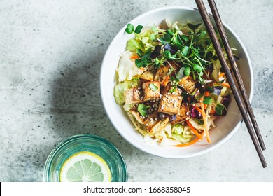 Fried Tofu Salad With Sprouts And Sesame Seeds In A White Bowl. Vegan Food, Asian Food Concept.