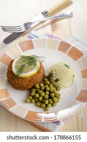 Fried Trout Fishcake With Irish Champ And Pea On A Plate