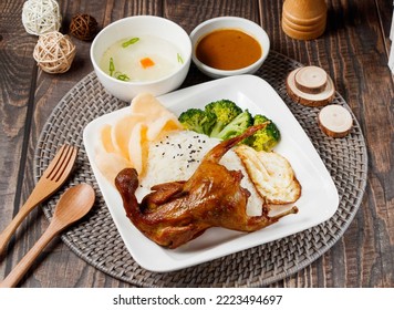 Fried Turtledove Rice with sauce and soup served in dish isolated on table side view of taiwan food