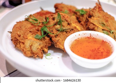 Fried Ukoy With Sweet And Spicy Vinegar For Dipping, A Common Filipino Dish Eaten During Snacks.