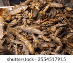 Fried Wader kali (Fried rasbora) or minnow fried from local river to eat with hot steam rice ready for sale