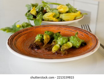 Fried Yellow Flowers Of A Small Decorative Gourd. Fried Pumpkin Flower As Summer Appetizers.