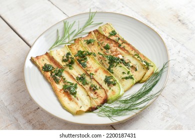 Fried Zucchini On Plate Over Wooden Background With Free Text Space. Top View