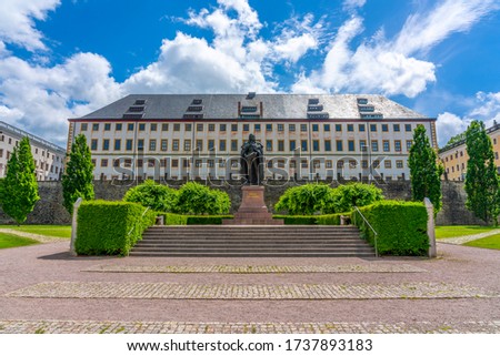 Friedenstein Castle and the stature of Ernst the Pious in Gotha, Thuringia, Germany