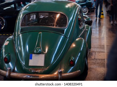 Friedrichshafen, Germany - May 5, 2019: Tuning World Bodensee. Big cars exibition in Germany. Ladybug green, retro car. Back view - Shutterstock ID 1408320491