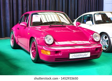 FRIEDRICHSHAFEN - MAY 2019: pink PORSCHE 911 964 RS CARRERA 1992 coupe  at Motorworld Classics Bodensee on May 11, 2019 in Friedrichshafen, Germany.