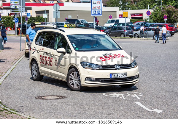 Friedrichshafen/Germany-August 2018 :Taxi for\
passengers drive on  city\
street.