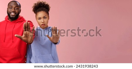 Friend asking stop worrying health raise palm forbidden enough dangerous gesture. Two african american man woman show hand prohibition taboo gesture persuading quit smoking, pink background.
