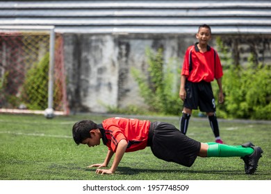 Friend boy teens push up push-ups workout in a grass
 - Powered by Shutterstock