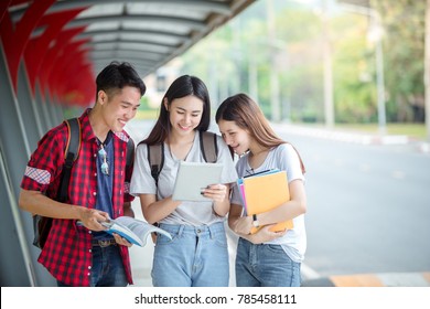 Friend Students Asian Stand To Read Books At University To Find Knowledge Outside The Classroom