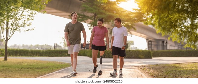 Friend support Friend with a prosthetic leg while exercising outdoor. People walking together on park outdoor. Exercise walking woman with prosthetic leg and friend support together in park outdoor - Powered by Shutterstock