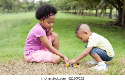 Friendly African American Kids Playing Each Other In Park