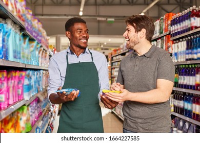 Friendly African seller in the supermarket at a customer consultation - Powered by Shutterstock - Get 15% off with code: PIKWIZARD15