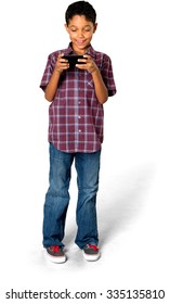 Friendly African young boy with short black hair in casual outfit using mobile phone - Isolated