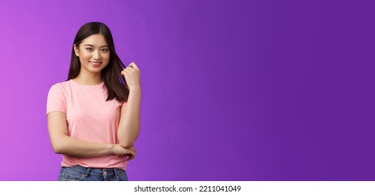 Friendly Attractive Stylish Woman Asian Playing Hair Stran, Touching Haircut, Smiling Joyfully, Cross One Arm Casual Relaxed Pose, Keep Interesting Lovely Conversation, Flirting Look Amused