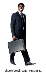 Friendly Black Businessman Walking With His Briefcase Smiling And Happy