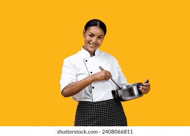 Friendly black female chef stirring stainless steel pot and smiling at camera, african american cook woman cooking against bright yellow background, epitomizing passion for her culinary craft - Powered by Shutterstock