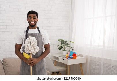 Friendly Black Janitor With Mop, Professional Cleaning Service Worker, Copy Space