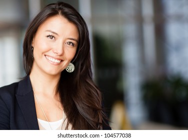 Friendly Business Woman Smiling At The Office