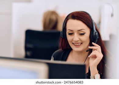 Friendly Call Center Agent Answering Incoming Calls with Headset Providing Remote Customer Service. - Powered by Shutterstock