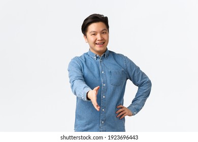 Friendly Cheerful Asian Man Searching For Job, Come To Interview, Extending Hand For Handshake, Greeting Someone, Welcome To Office, Saying Hello With Happy Smile, White Background